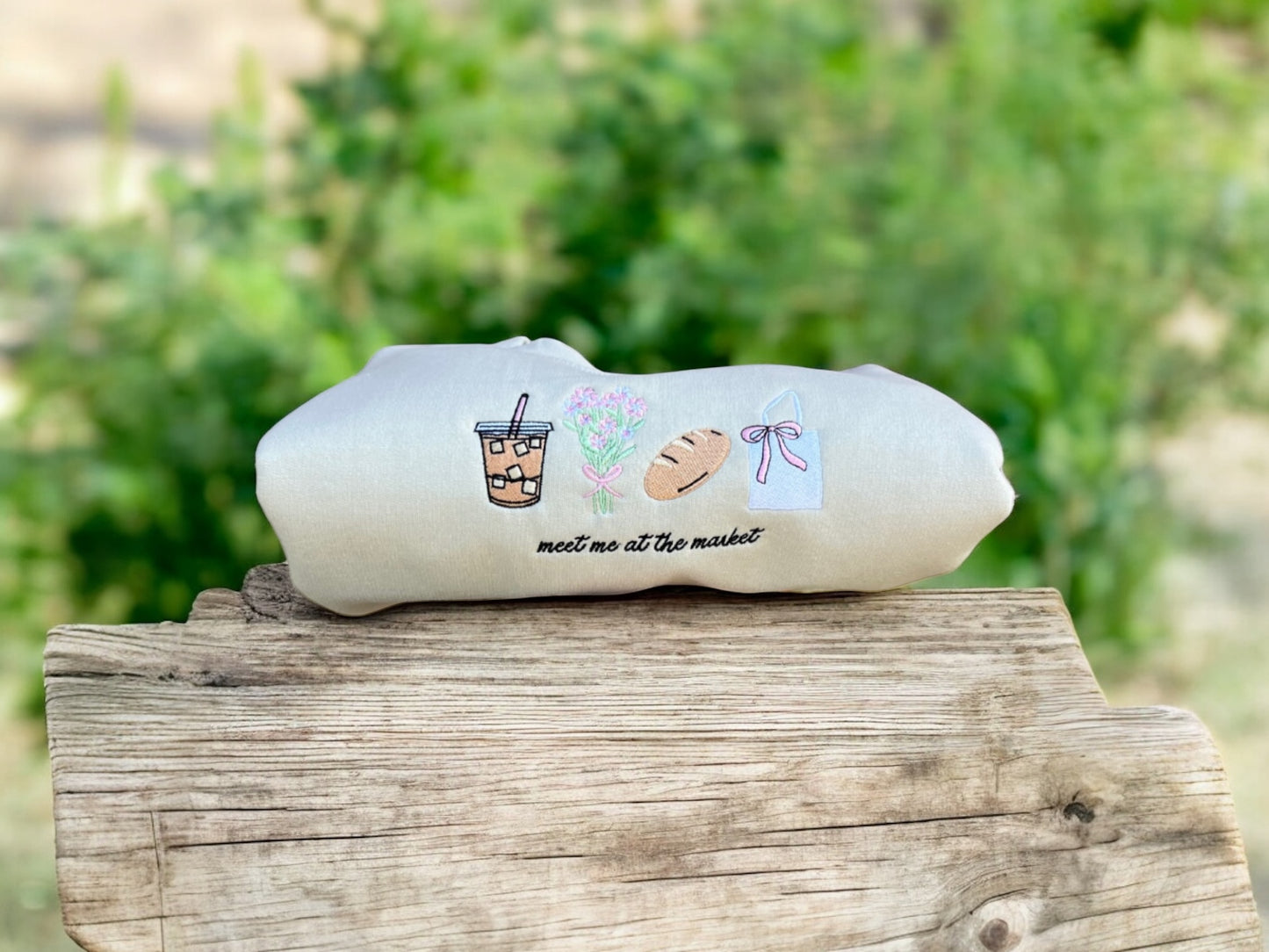 meet me at the market crew on a wooden surface outdoors